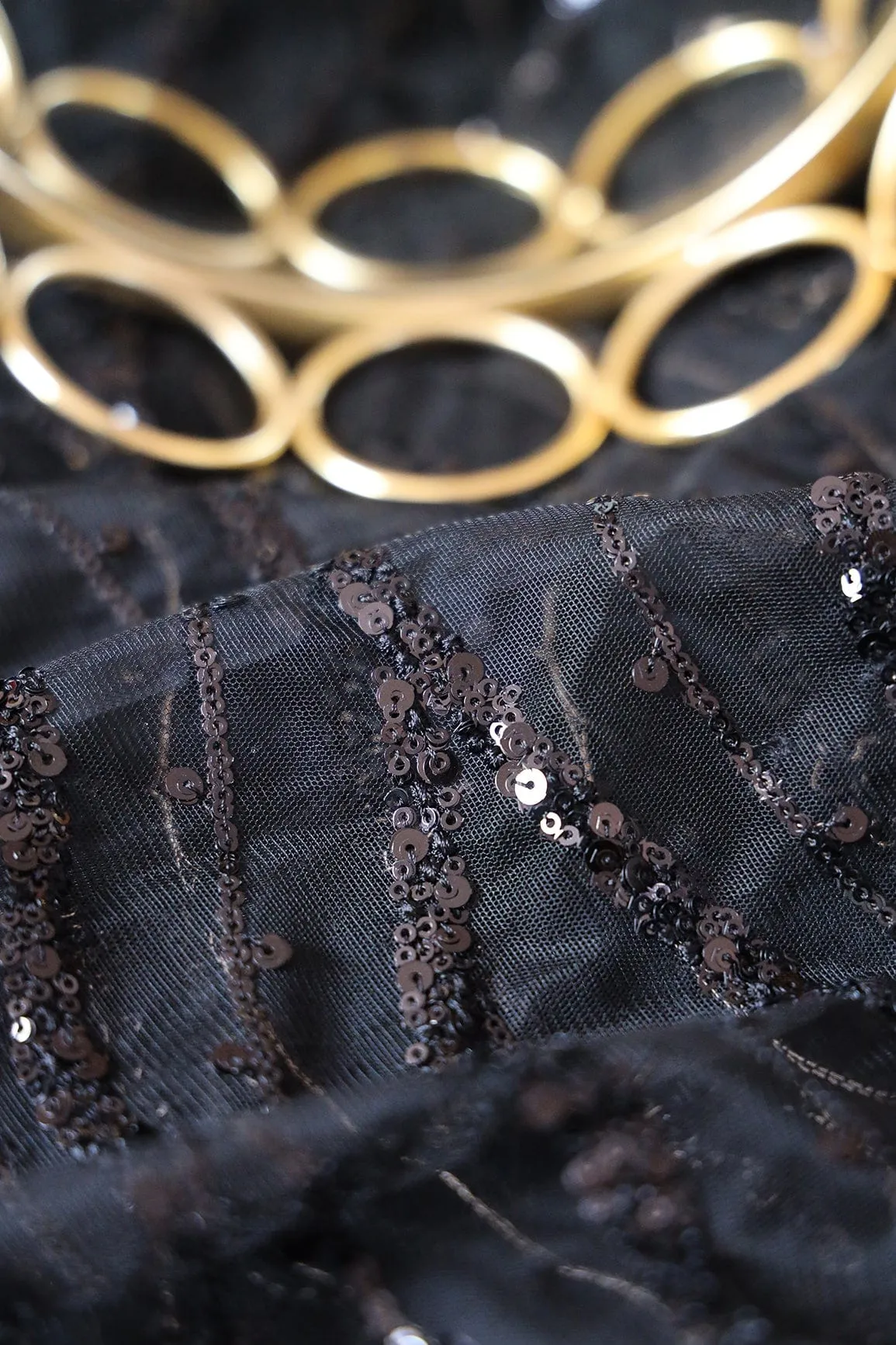 Beautiful Sequins With Black Thread Wavy Embroidery Work On Black Soft Net Fabric