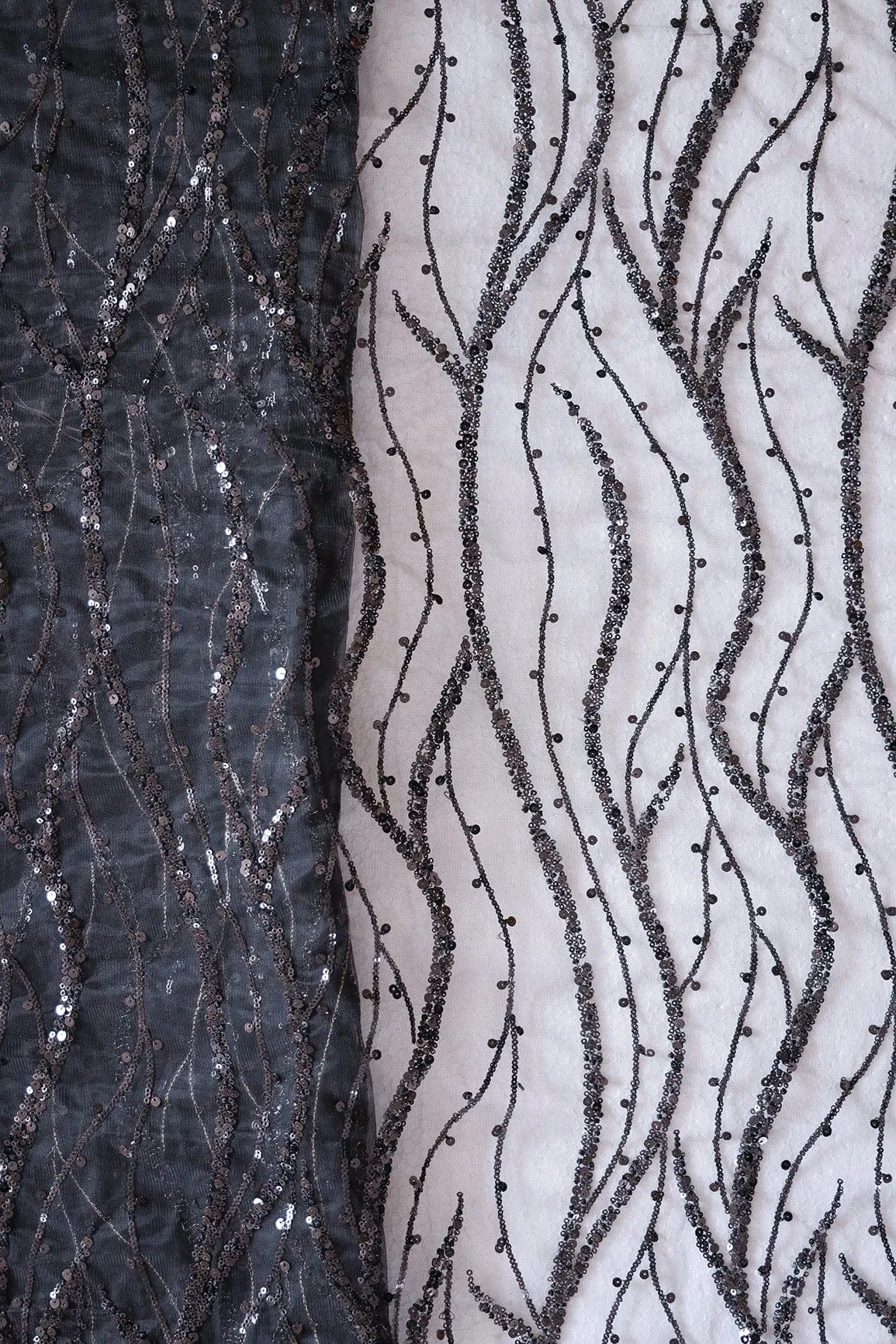 Beautiful Sequins With Black Thread Wavy Embroidery Work On Black Soft Net Fabric