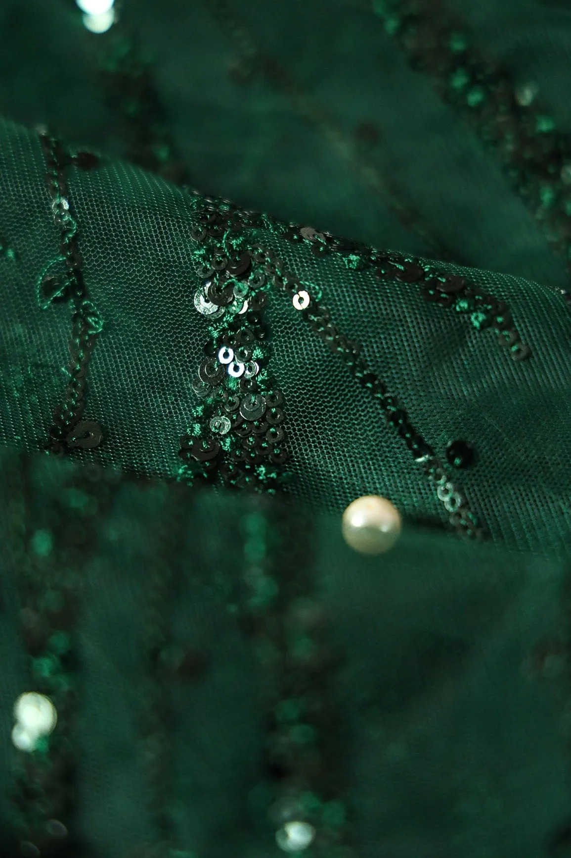 Beautiful Sequins With Green Thread Wavy Embroidery Work On Bottle Green Soft Net Fabric