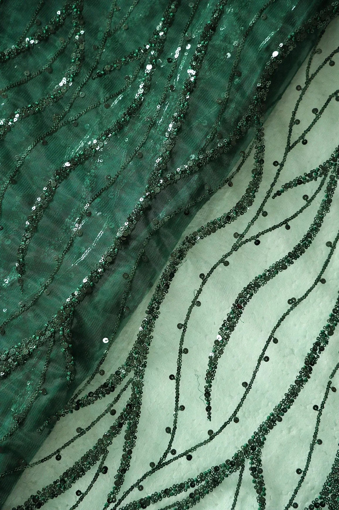 Beautiful Sequins With Green Thread Wavy Embroidery Work On Bottle Green Soft Net Fabric