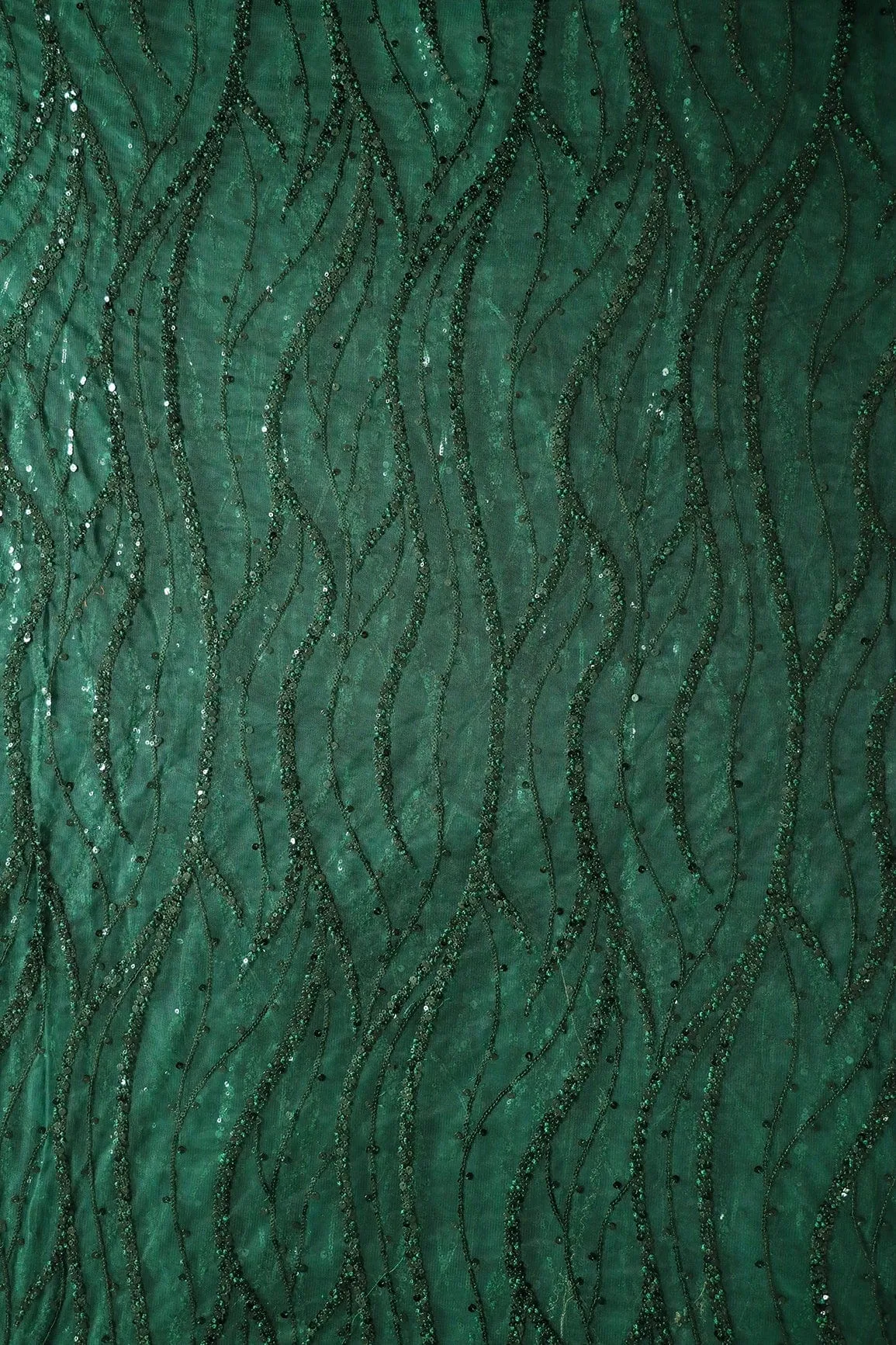 Beautiful Sequins With Green Thread Wavy Embroidery Work On Bottle Green Soft Net Fabric