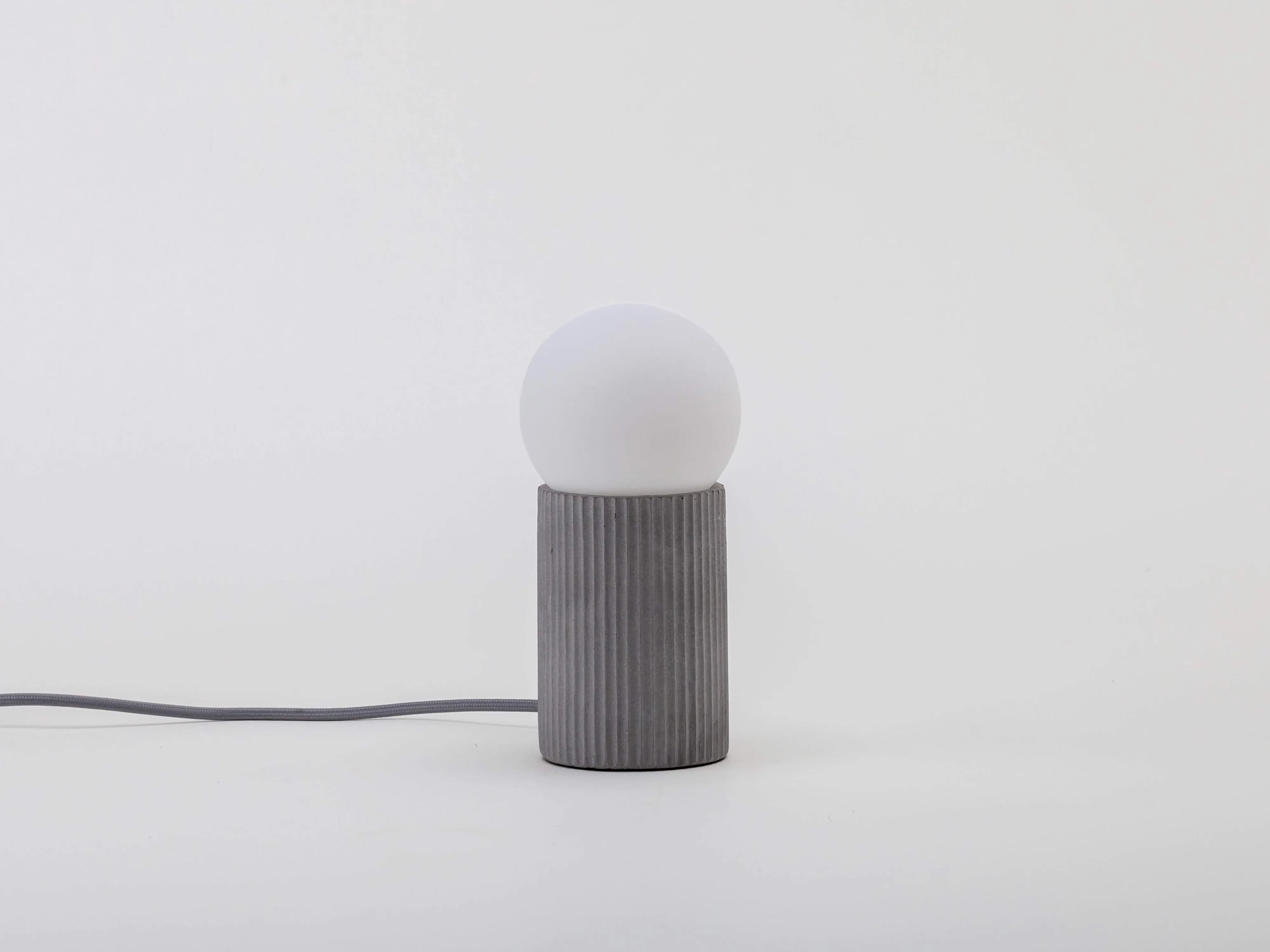 Grey concrete ribbed table lamp