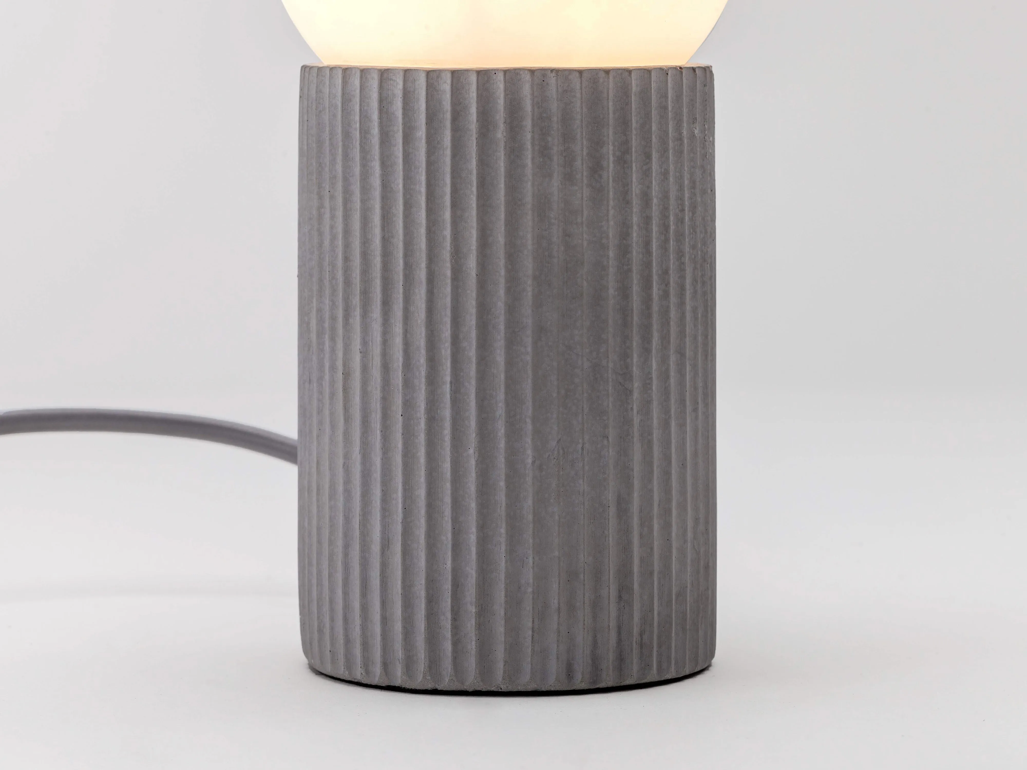 Grey concrete ribbed table lamp